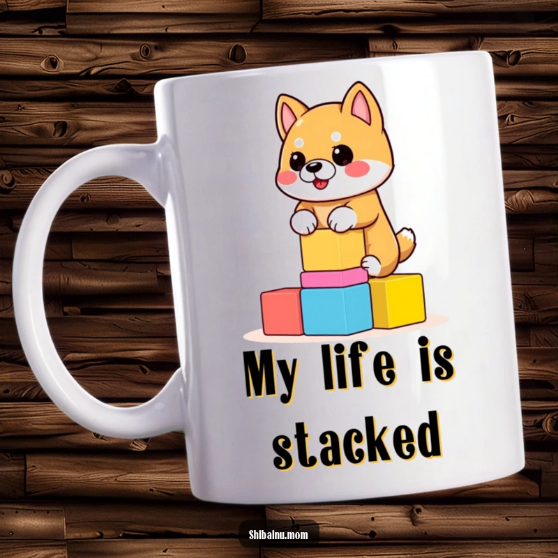 Funny Shiba Inu Mug featuring a dog precariously balancing colorful, wobbly blocks. A humorous depiction, great funny gift.