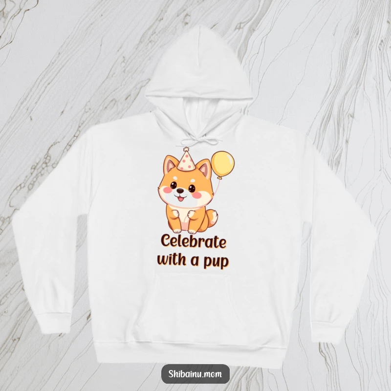 Funny Shiba Inu hoodie featuring a fluffy dog adorned with a party hat and holding a balloon, ready for festivities.