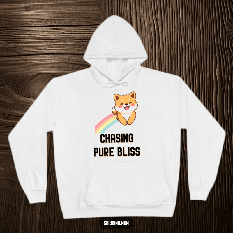 Funny Shiba Inu Hoodie: A Shiba Inu smiles broadly as it slides down a rainbow, a symbol of pure joy and adventure.