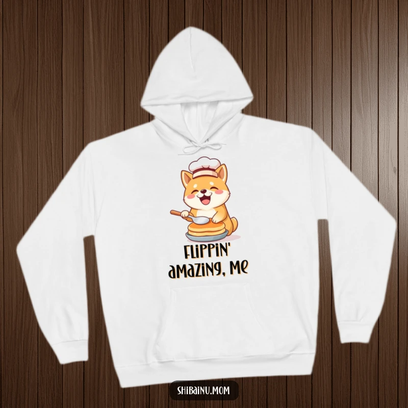 Funny Shiba Inu chef hoodie with a small hat, captured mid-pancake flip, exuding joy and culinary ambition.