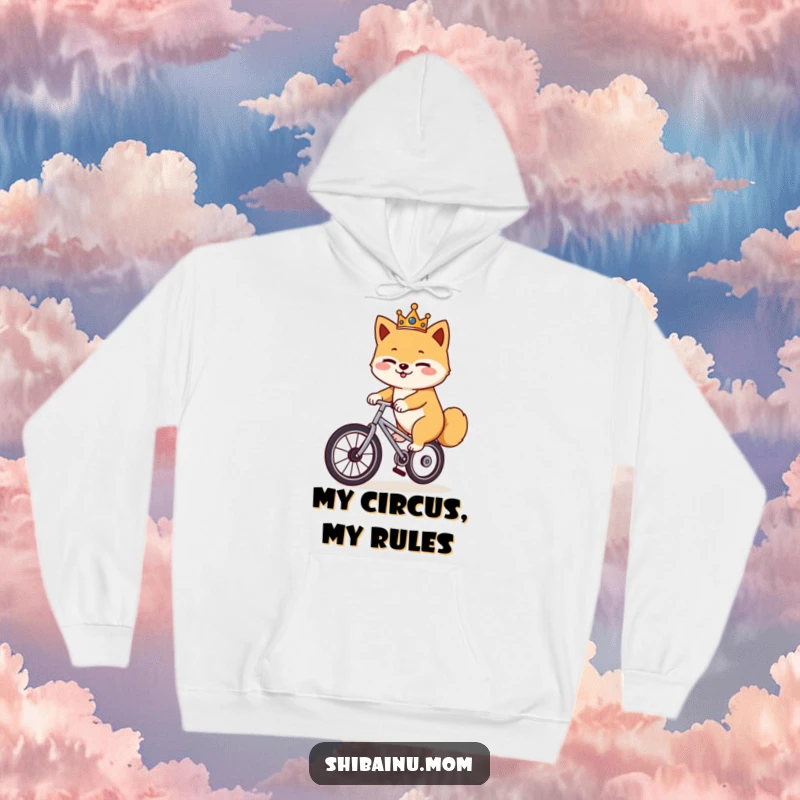 Funny Shiba Inu unicycle hoodie, a crowned dog winks while balancing on a unicycle, cozy and humorous winter wear.