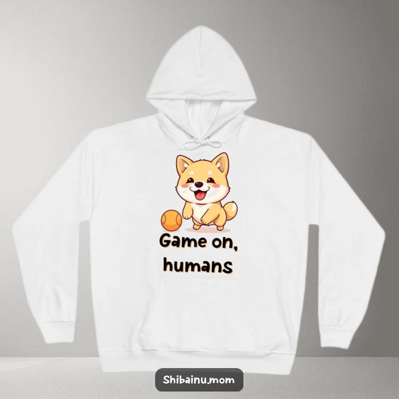 Funny Shiba Inu dribbling ball hoodie, a cozy sweatshirt featuring an energetic dog playing with a ball, humorous activewear.