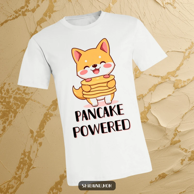 Funny Shiba Inu t-shirt featuring a smiling doggle proudly carrying a precarious stack of delicious pancakes.